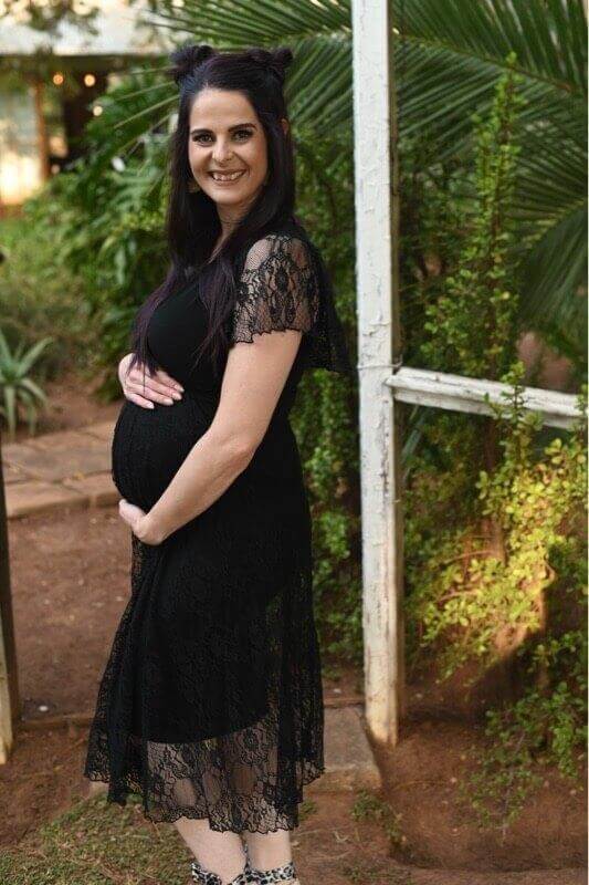 Black lace maternity dress with fitted bodice and frilly lace sleeves