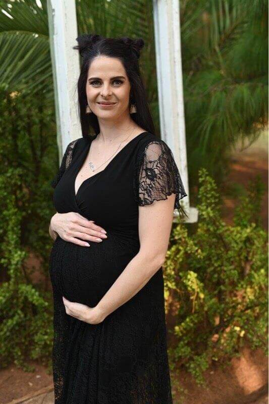 Black lace maternity dress with fitted bodice and frilly lace sleeves