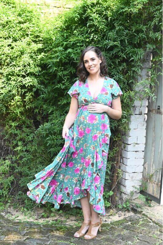 Green and pink floral wrap maternity dress with ruffles and frilly sleeves