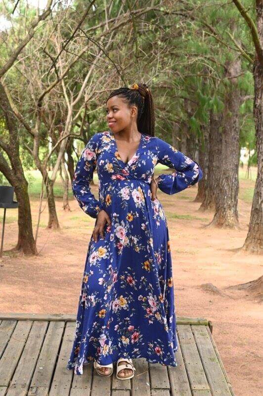 Navy blue floral maternity and nursing dress with foldover bodice and slit-detailed long sleeves