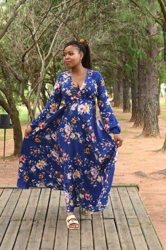 Navy blue floral maternity and nursing dress with foldover bodice and slit-detailed long sleeves