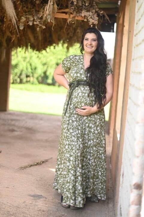 Olive green floral maternity and nursing dress with foldover bodice, short sleeves, and long viscose skirt