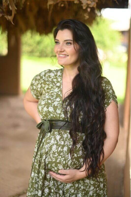 Olive green floral maternity and nursing dress with foldover bodice, short sleeves, and long viscose skirt