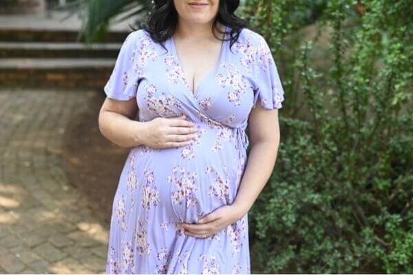 Lilac floral wrap maternity and nursing dress with frilly sleeves and short viscose silhouette