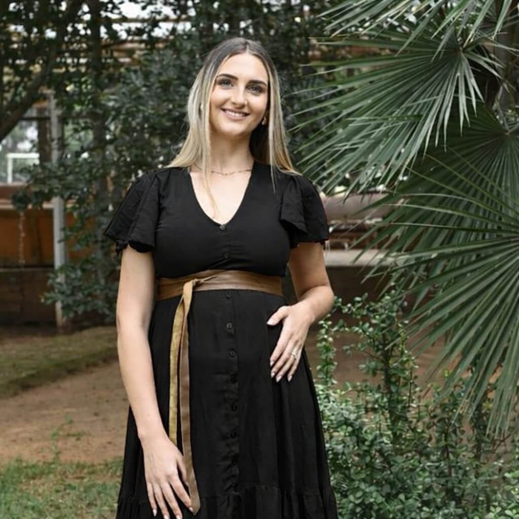 Black button-up maternity and nursing dress with layered ruffle skirt and frilly sleeves