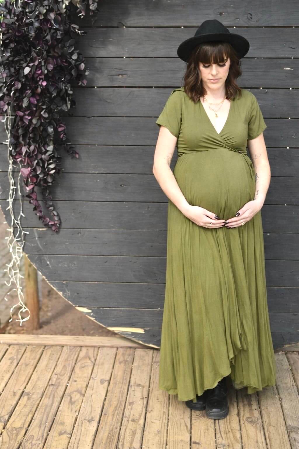 Olive wrap maternity and nursing dress with shirt collar, short sleeves, and hi-low viscose silhouette