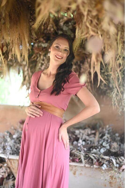 Rose pink maternity and nursing dress with button-up front, short sleeves, and hi-low silhouette