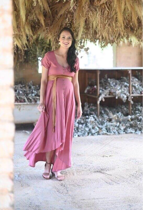 Rose pink maternity and nursing dress with button-up front, short sleeves, and hi-low silhouette
