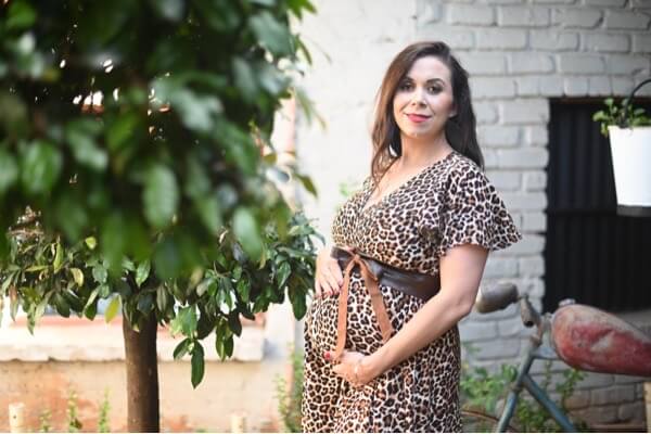 Leopard print wrap maternity and nursing dress with short sleeves and hi-low silhouette