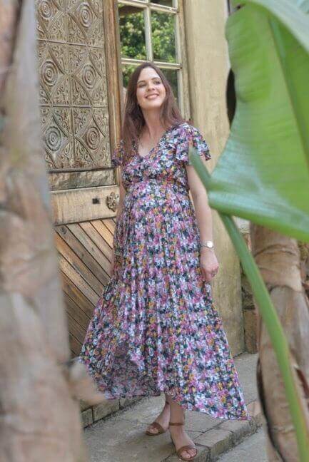 Vintage colorful floral maternity and nursing dress with button-up front, frilly sleeves, and hi-low silhouette