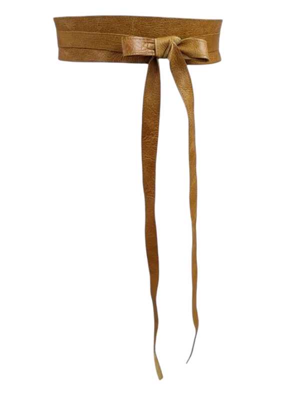 Woman wearing a self-adjustable leather waist belt over a floral maternity dress
