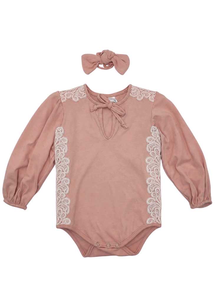 Pastel coral baby romper with white lace detail and matching headband