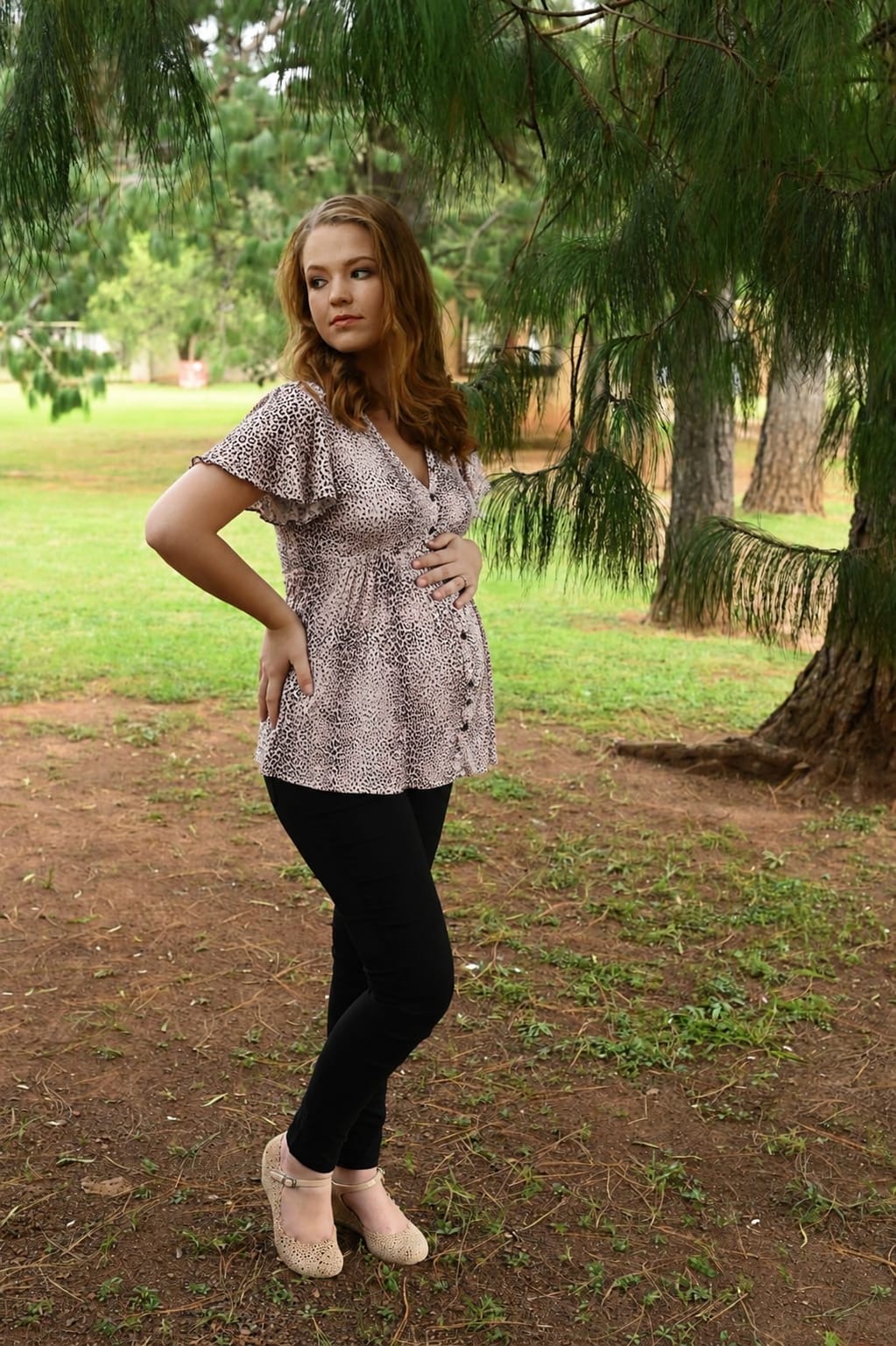 Beige leopard maternity and breastfeeding top with press studs worn during pregnancy